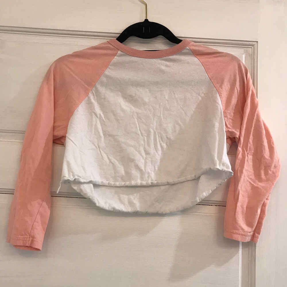 Cropped pink and white shirt.